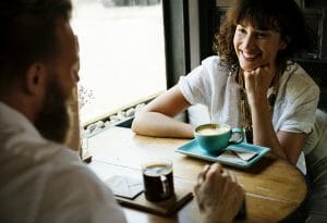couple chatting, coffee, Cancer Capricorn Love Compatibility